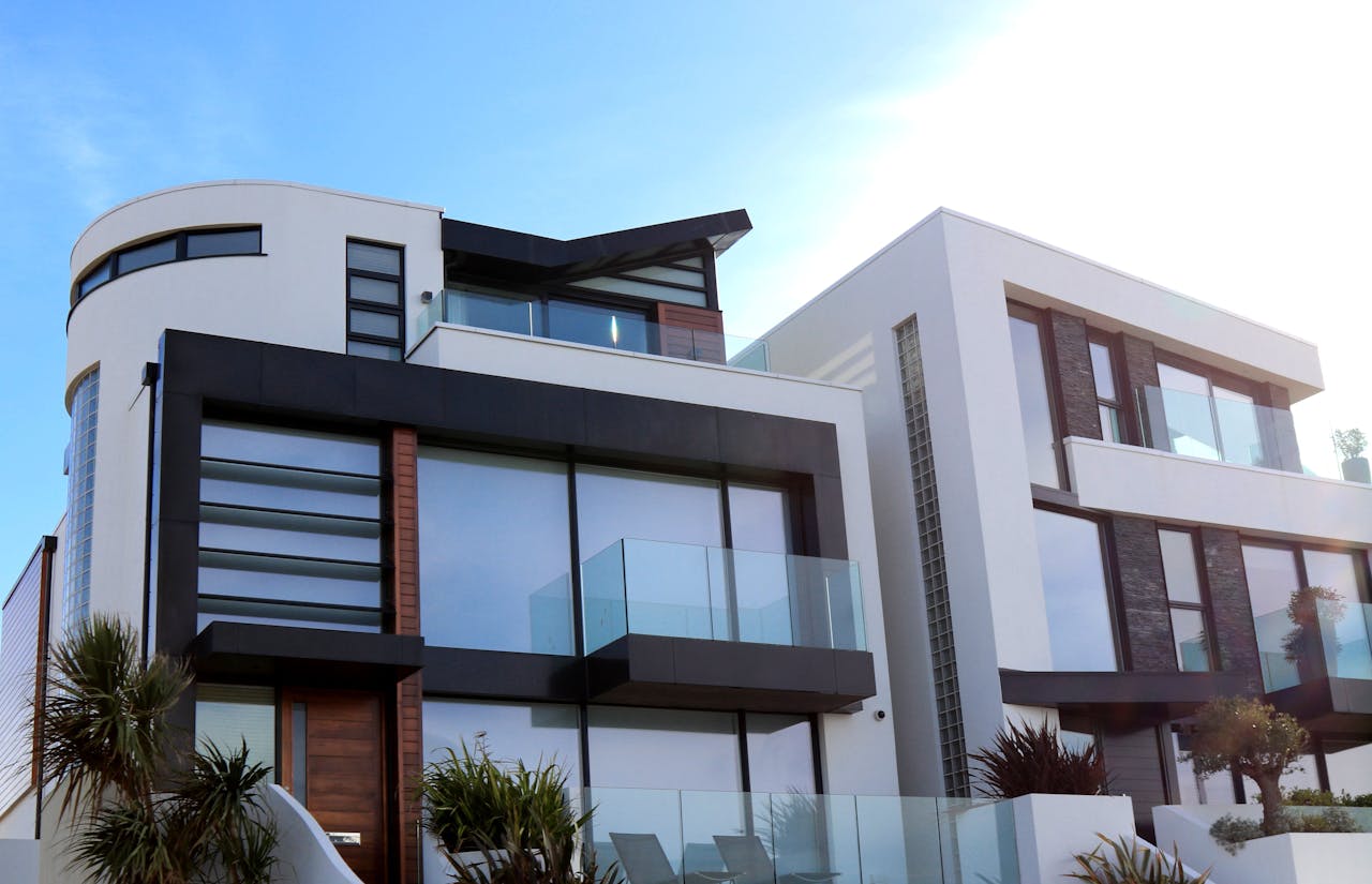 about-02 Contemporary luxury home with glass balconies in Poole, UK, showcasing modern architectural design.